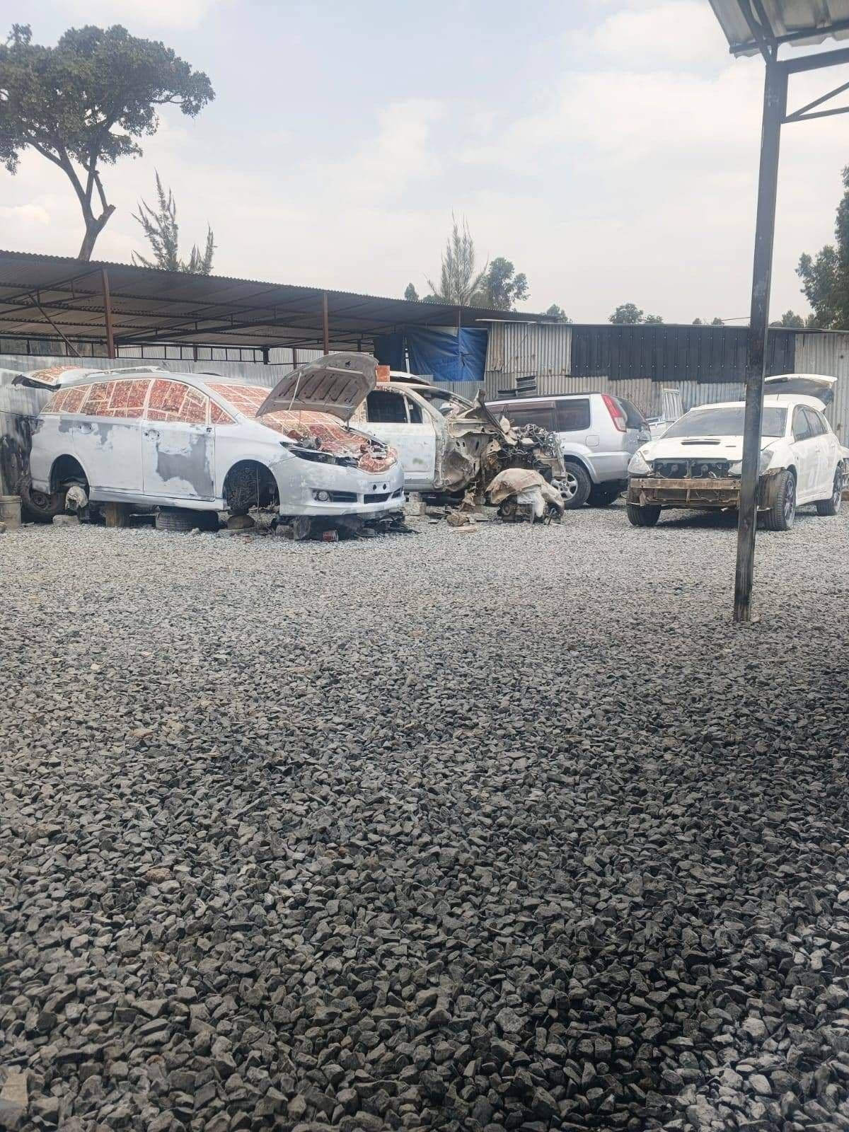 Workshop yard — vehicles in for panel beating & refinishing